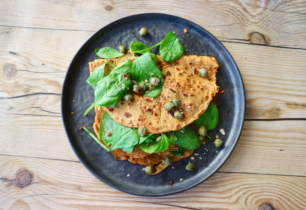 Sun-dried tomato chickpea pancakes with spinach