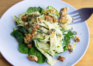 Creamy Courgettes with Sage, Capers and Smoky Tempeh on a Bed of Spinach
